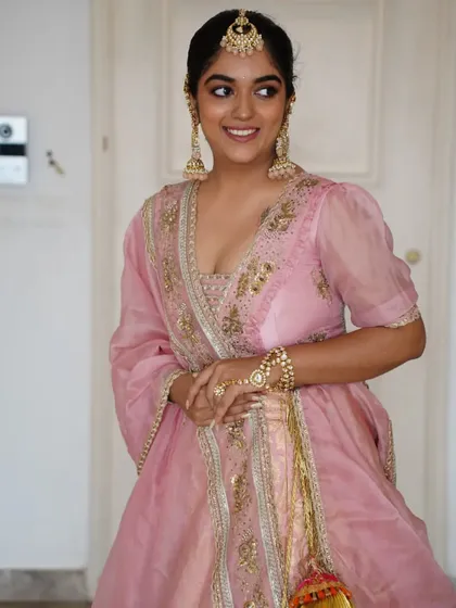 Another look at this gorgeous bride in her Gazal Gupta couture. The soft pink tones of the makeup perfectly match her outfit, creating a cohesive and stunning bridal style.