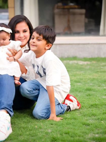 A mother enjoying a beautiful day outdoors with her two children. Our outdoor family sessions are perfect for capturing natural, relaxed moments.