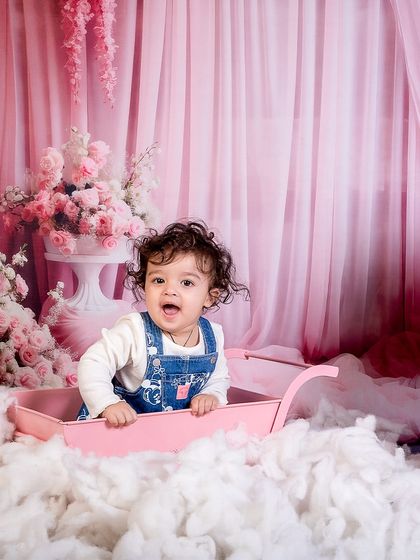 A happy giggle from our little Barbie. Her joyful expression is the centerpiece of this magical and whimsical photoshoot.