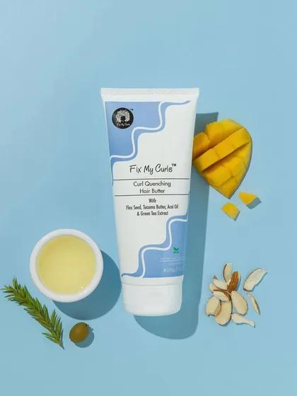 This vibrant, color-coordinated flatlay uses a bright blue background to make the natural ingredients pop. The composition with mango, almonds, and olive oil is fresh, tropical, and appealing.