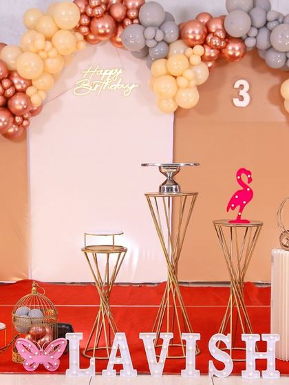 A charming 'Baby Boss' themed birthday party, with a sophisticated black and white color scheme, custom props, and a stylish backdrop, perfect for a little executive.