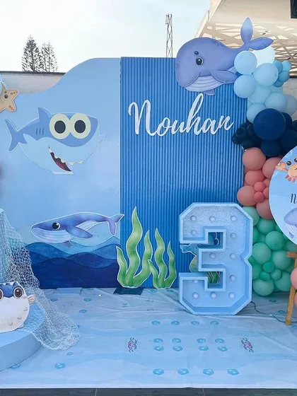 A full view of Nouhan's 'Under the Sea' birthday stage. The setup includes a personalized backdrop, a light-up number '3', and a welcome sign, creating a complete and immersive photo zone.