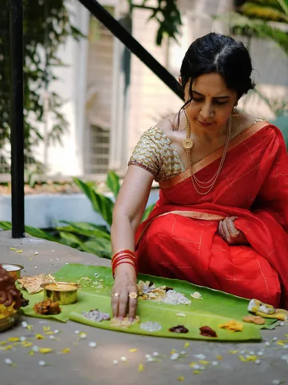 A moment of reverence for the food. Here, I am enjoying a traditional Sadya, with the Kootu Curry and other dishes laid out on the banana leaf, a ritual that connects me to my roots.