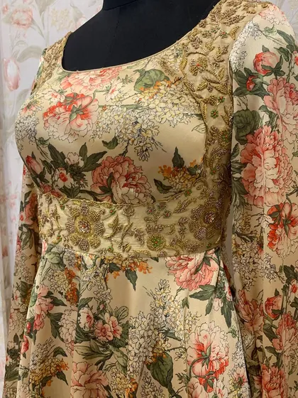 A side view of the floral Anarkali, showing the intricate hand embroidery on the yoke and the flattering silhouette of the dress.