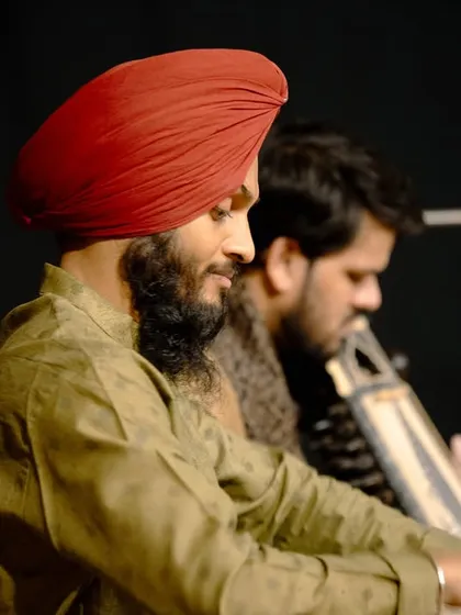 A side profile from a performance in Bangalore, showing the deep concentration required when accompanying another artist.