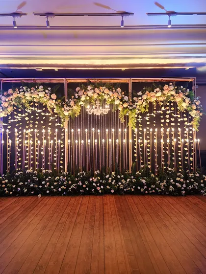 A straight-on view of the expansive candle wall backdrop before the seating is placed. This highlights the scale and symmetry of the design, perfect for large corporate events or grand wedding receptions.
