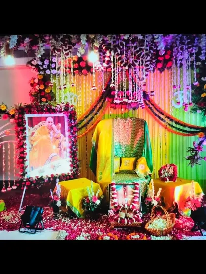 For this Guruji Satsang, the theme was yellow and green. I used drapes and marigold garlands to create a bright backdrop, with a dense floral canopy overhead and spotlights to highlight the Aasan.