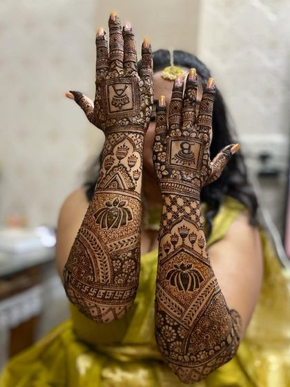 Another pose showcasing the beautiful lotus and kalash mehandi design.