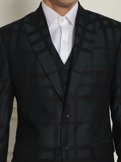 A close-up of the subtle checkered pattern on our black formal suit, perfect for corporate or occasion wear.