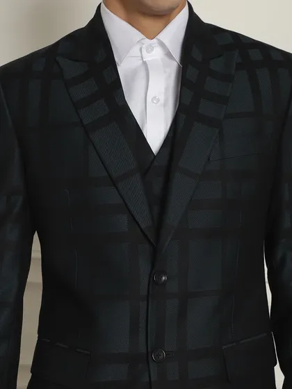 A close-up of the subtle checkered pattern on our black formal suit, perfect for corporate or occasion wear.