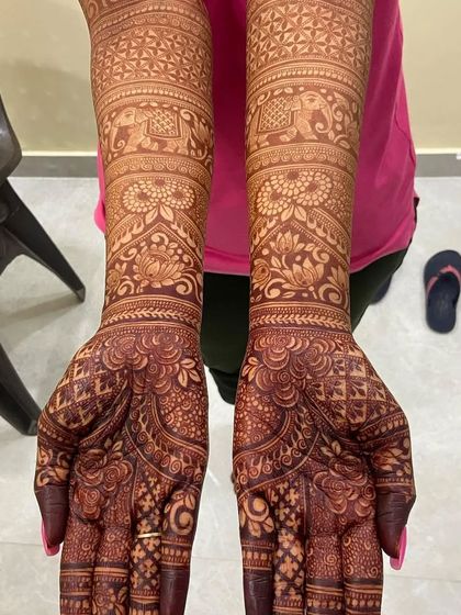 Another example of a rich, dark henna stain, with traditional elephant and lotus motifs.