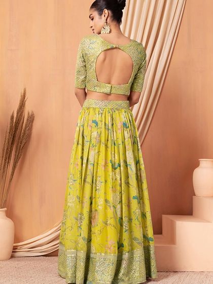 The perfect Haldi outfit. This yellow organza lehenga is bright, cheerful, and adorned with sequins to make you shine on your special day.