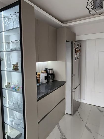 A complete view of the crockery and pantry section in Pamposh Enclave. The combination of open display and closed storage creates a balanced and highly practical solution for modern homes.