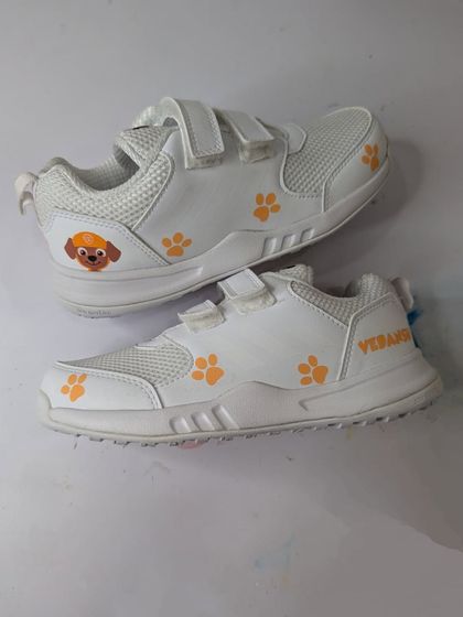 Another finished pair, this time featuring Zuma and orange paw prints. Each pair was personalized with the child's name.