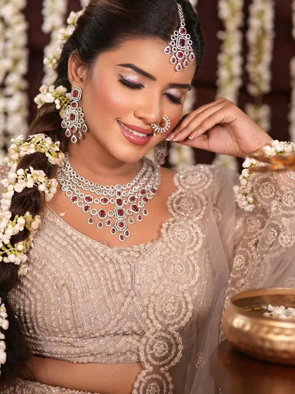 A close-up of the bride's soft, glowing makeup. The subtle shimmer on the eyes and the perfectly blended blush create a radiant and ethereal look.