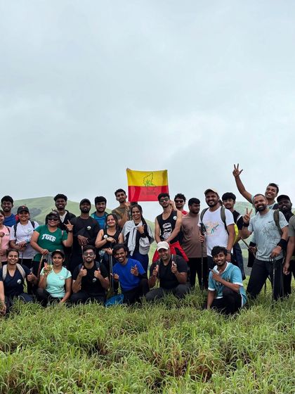 Our group proudly holding the Karnataka flag after a successful Bandaje trek. We love celebrating our local pride.