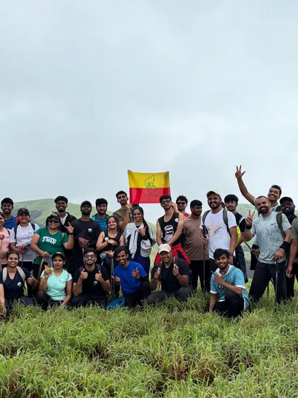 Our group proudly holding the Karnataka flag after a successful Bandaje trek. We love celebrating our local pride.