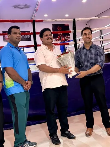A moment of appreciation as our founder presents a bouquet to an esteemed guest during the tournament.