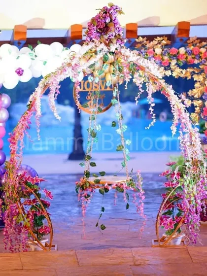 I love creating unique, picture-perfect moments like this whimsical floral swing. It can serve as a beautiful cradle for a naming ceremony or a stunning photo opportunity, decorated with cascading flowers and fairy lights.