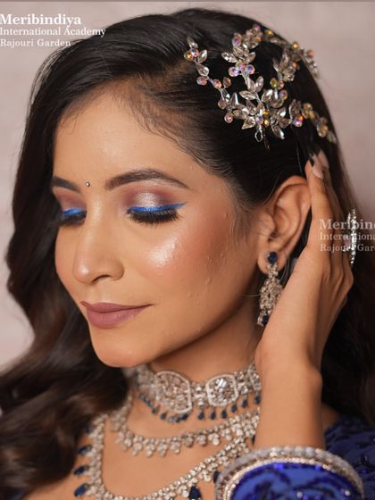 A detailed shot of a dramatic blue winged eyeliner, a creative twist on a classic look that you will learn to master.