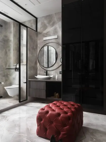 Another view of the dark and dramatic bathroom, highlighting the clean lines of the wall-mounted toilet and the minimalist vanity. This space proves that bathrooms can be as stylish and thoughtfully designed as any other room.