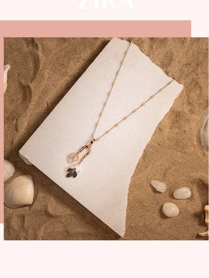 A simple and elegant Italian chain pendant in rose gold, featuring black and white CZ diamond charms.