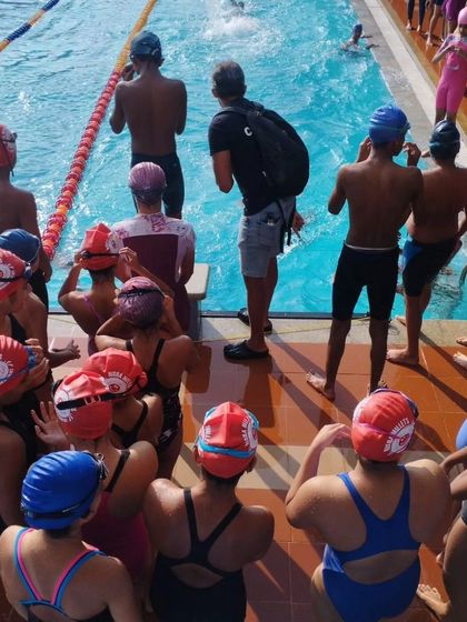 A quick team huddle between races. I use these moments to discuss strategy, give encouragement, and make sure everyone is focused. The team spirit was amazing all weekend.