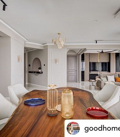 A view of the dining area in the 'Urban Tranquility' project, featuring a live-edge wooden table that adds a natural, wabi-sabi element to the modern space.