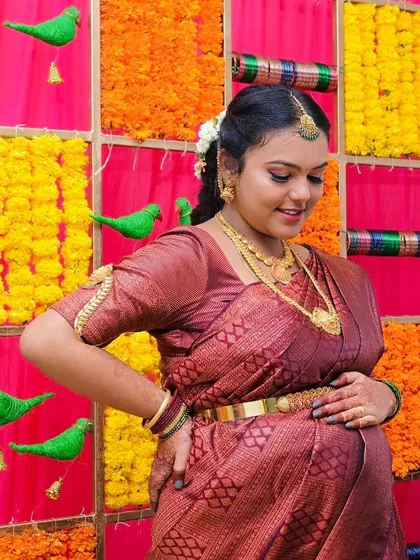 This mom-to-be looks absolutely radiant. The makeup for her baby shower was kept elegant and traditional, with a focus on flawless skin and soft, defined features.