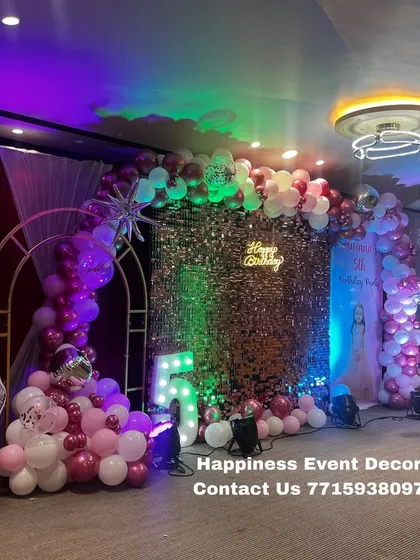 I create magical princess-themed birthday parties like this one. This premium setup includes a sparkling sequin backdrop, a balloon arch in the theme's colors, and life-sized cutouts of popular princesses to complete the fairy tale look.