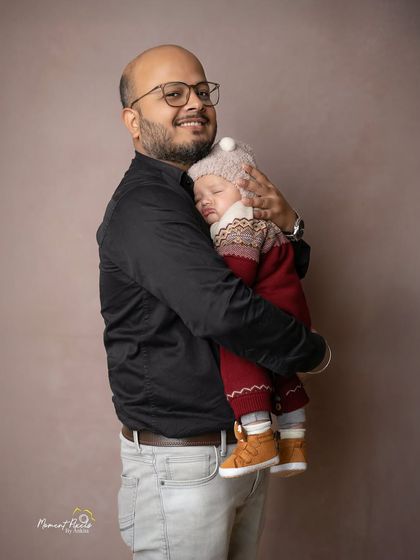 A father's embrace. This peaceful moment of a dad holding his sleeping baby close is a powerful and emotional portrait of fatherhood.