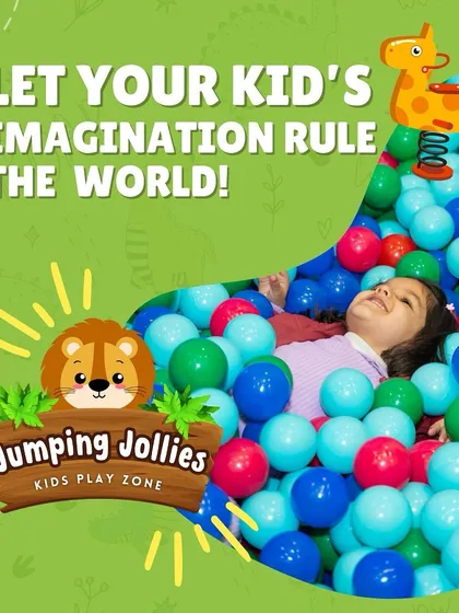A child relaxing in the ball pit, surrounded by a sea of blue and green balls. It's a perfect visual of carefree fun.