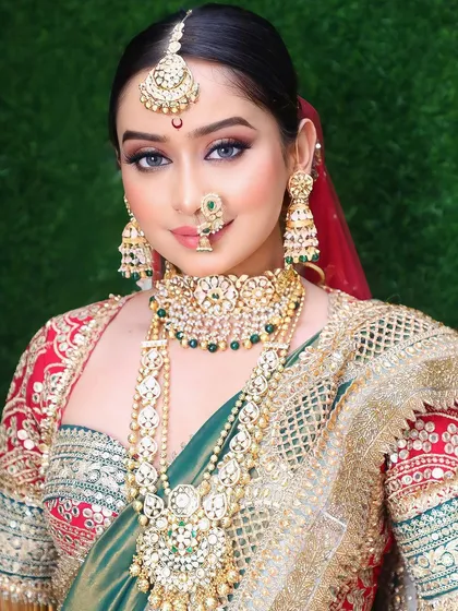 A close-up of the intricate details from our live demo. The look features a traditional nath, a chandrakor bindi, and dramatic eye makeup to create a powerful bridal statement.