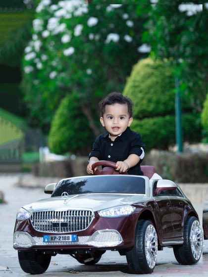 A happy driver enjoying his cruise through the park.