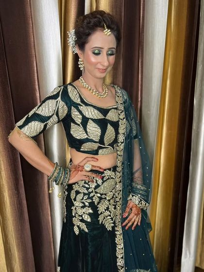 A soft, textured updo with loose, face-framing pieces. This romantic hairstyle is perfect for an engagement ceremony or a bridesmaid's look.