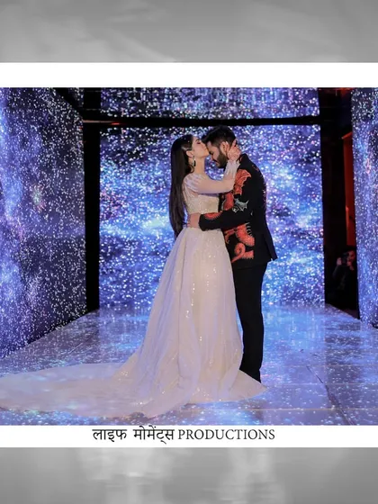 A romantic portrait of the engaged couple against a stunning 'starry night' LED wall. We design these photo opportunities to be as memorable as the event itself.