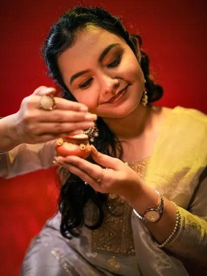 A smiling shot that captures the joy of the festival, enhanced by our professional lighting.