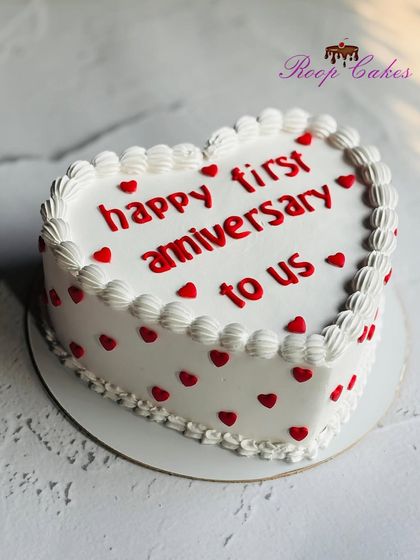Celebrating love, memories, and forever together with this classic heart-shaped cake for a first anniversary.