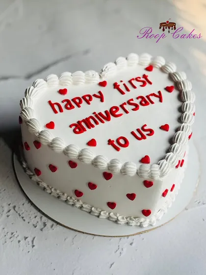 Celebrating love, memories, and forever together with this classic heart-shaped cake for a first anniversary.