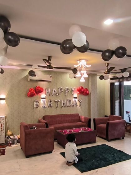 A wide view of the living room, showing how the balloon decorations tie the whole space together.