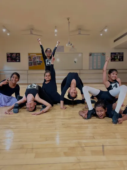 A fun, celebratory pyramid pose after a successful exam session. This picture perfectly captures the mix of hard work, achievement, and friendship that defines our certification program.