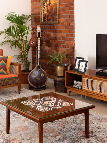 The Ramaniyam collection, a result of a deep collaboration with one of our earliest clients. This project includes a lounge sofa, tile-inlay center table, TV unit, dining set, and a statement console, all designed to reflect the client's cultural roots.