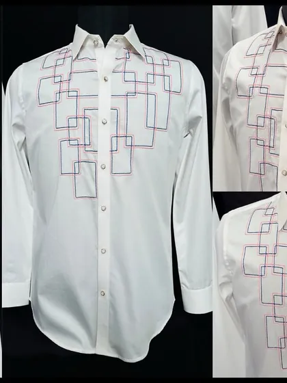 A detailed look at the 'Rainbow Grid' shirt, featuring intersecting embroidered squares in red and blue. This design is a modern, artistic take on a classic white shirt.