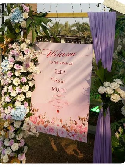 A personalized welcome sign for Zeba and Muhit's Nikah. The pastel lavender and pink floral design sets a gentle and romantic tone for the ceremony.