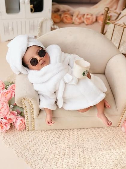 This ten day old rocked every pose like a true diva. Lounging with her sunglasses and a mini Starbucks cup, she is the star of her own luxurious spa day.