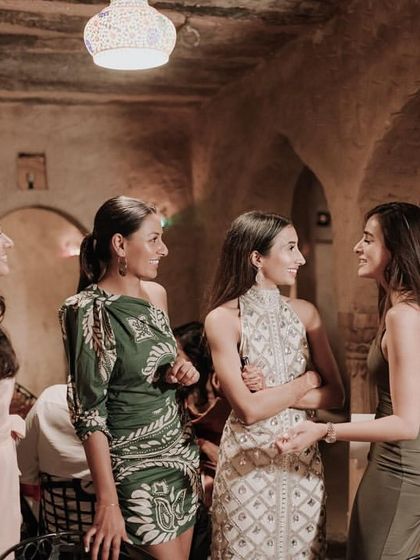 Candid moments and conversations from the welcome dinner, setting a warm and intimate tone for the wedding.