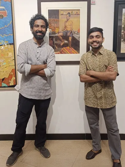With a friend at the Art Society of India exhibition, standing next to my award-winning painting "Bachelor."