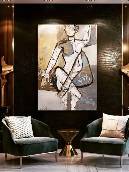 This image shows two of my dark green velvet lounge chairs in a dramatic, art-filled setting. I design accent chairs that can stand alone as pieces of art while providing comfortable seating.