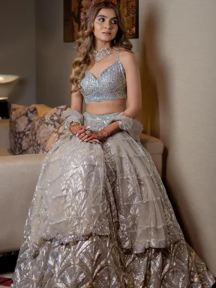 The complete look is a picture of modern bridal elegance, perfect for a chic reception or cocktail party.