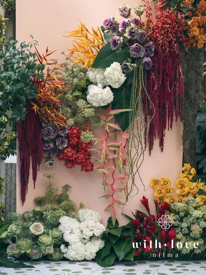 A detail of the vibrant floral wall from the 'Garden of Gaia' event.